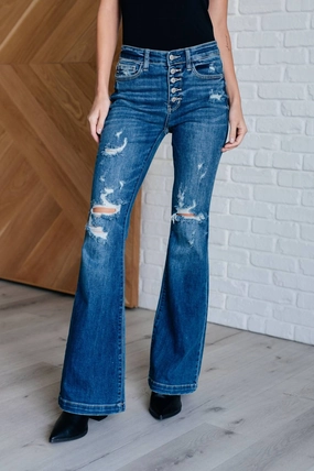 Mid Rise Distressed Button Fly Flare In Blue womens leather pants outlet