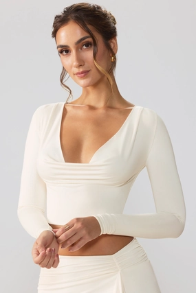 Slinky Jersey Plunge Neck Long Sleeve Crop Top Top in Ivory Tops - tops on sale