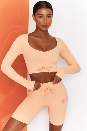 Time Check Ribbed Long Sleeve Crop Top in Peach Tops - tops on sale